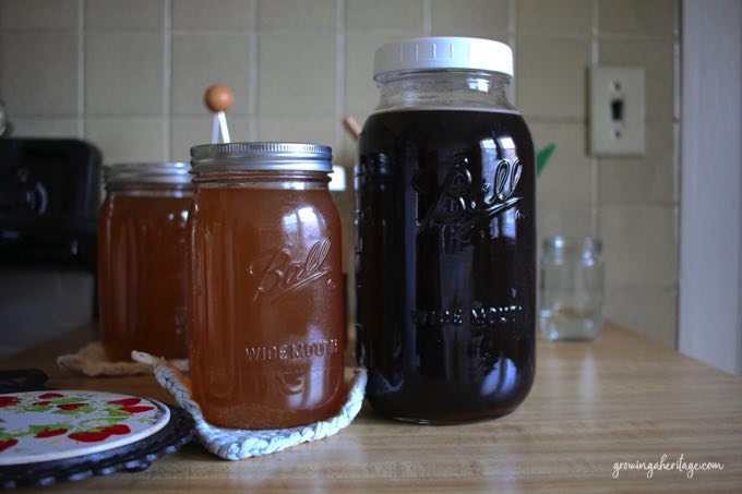 Bone broth and elderberry in large quart and half gallon mason jars
